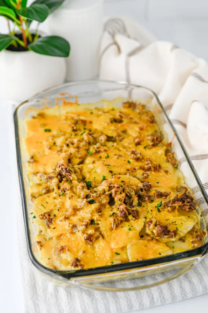 hamburger potato casserole in a glass baking pan