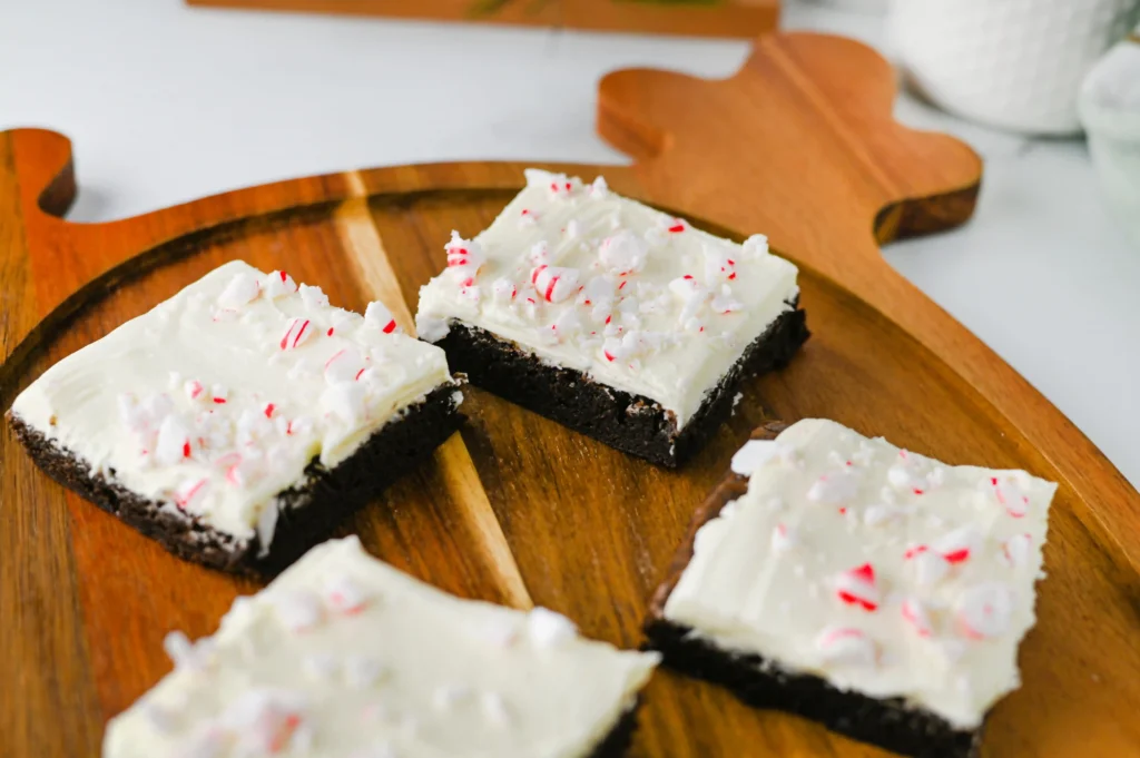 Peppermint brownies with crushed peppermint on a reindeer shaped wooden board