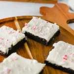 Peppermint brownies with crushed peppermint on a reindeer shaped wooden board
