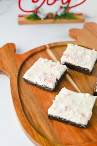 Peppermint brownies with crushed peppermint on a reindeer shaped wooden board