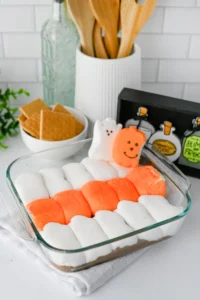 Halloween S'mores Dip with melted chocolate and halloween peep marshmallows
