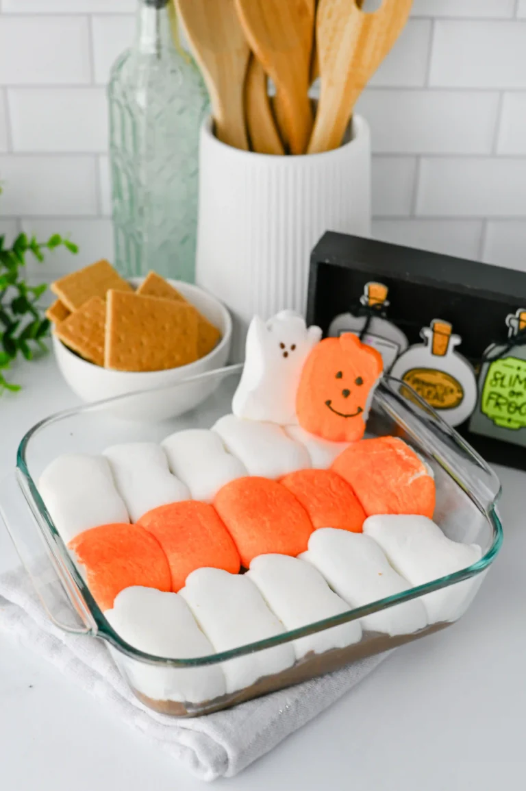Halloween S'mores Dip with melted chocolate and halloween peep marshmallows