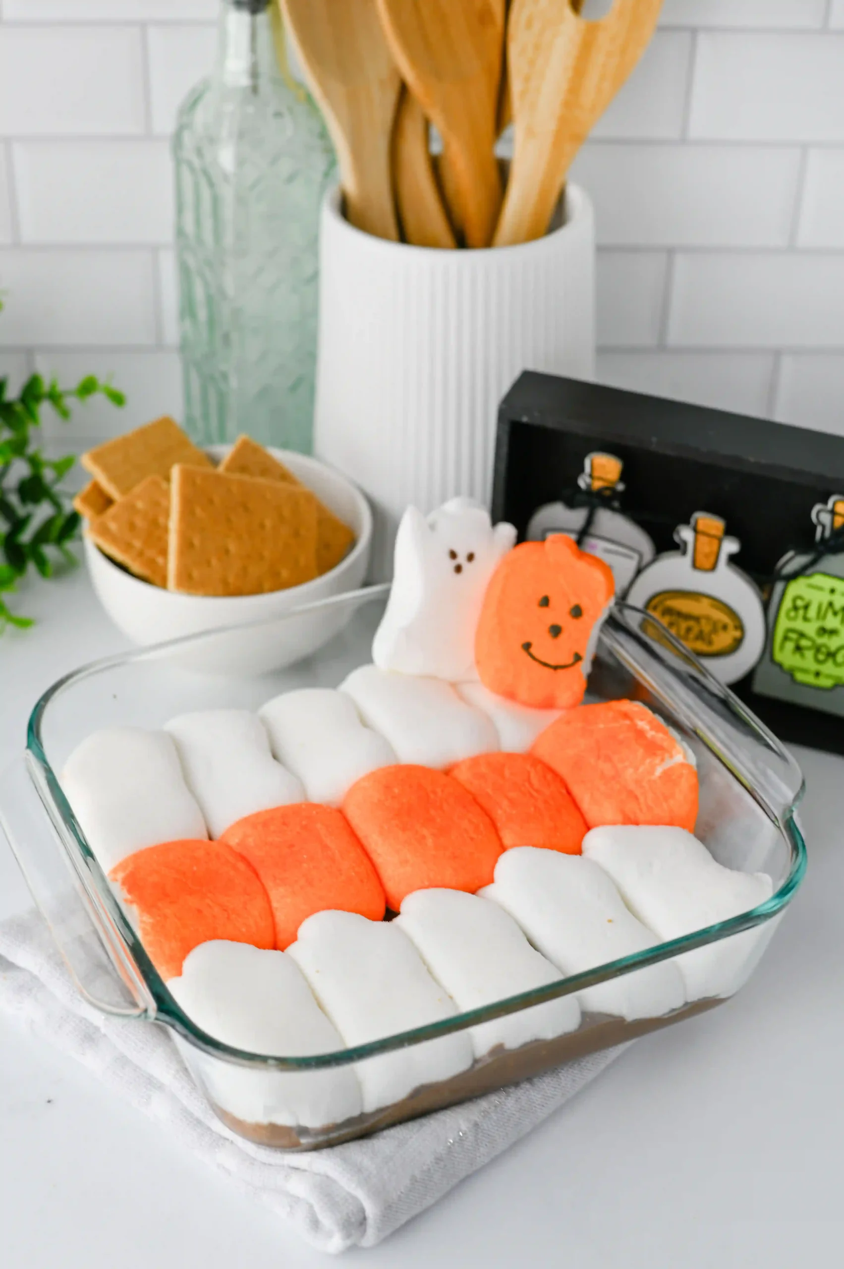 Halloween S'mores Dip with melted chocolate and halloween peep marshmallows