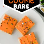 Halloween Sugar Cookie Bars with orange icing and halloween sprinkles