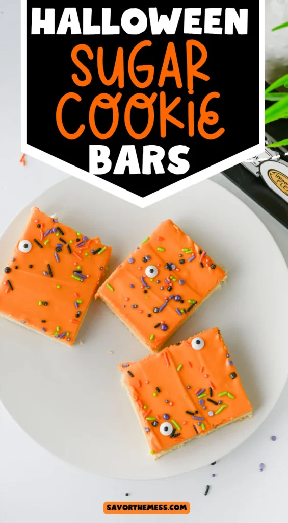 Halloween Sugar Cookie Bars with orange icing and halloween sprinkles