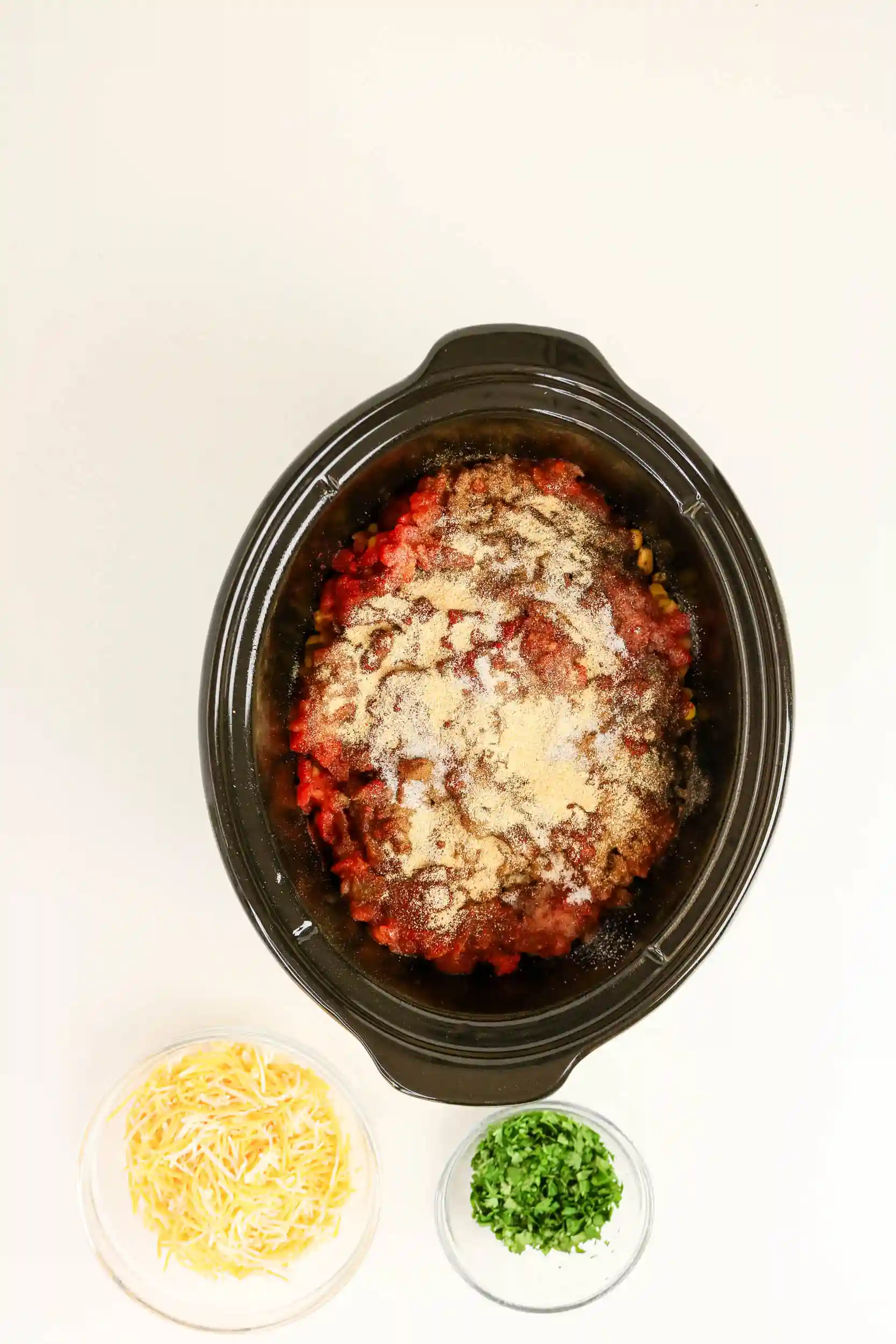 chicken, beans, corn, peppers, and tomatoes in a crockpot