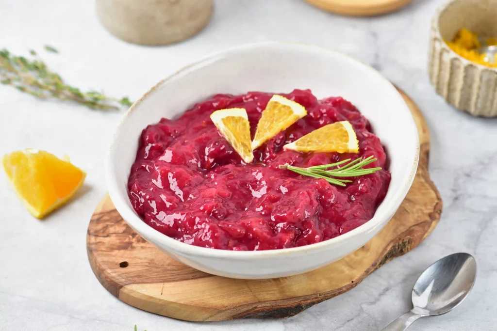homemade cranberry sauce in a bowl with orange slices