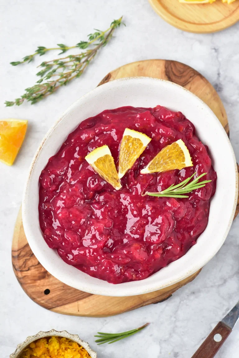 homemade cranberry sauce in a bowl with orange slices