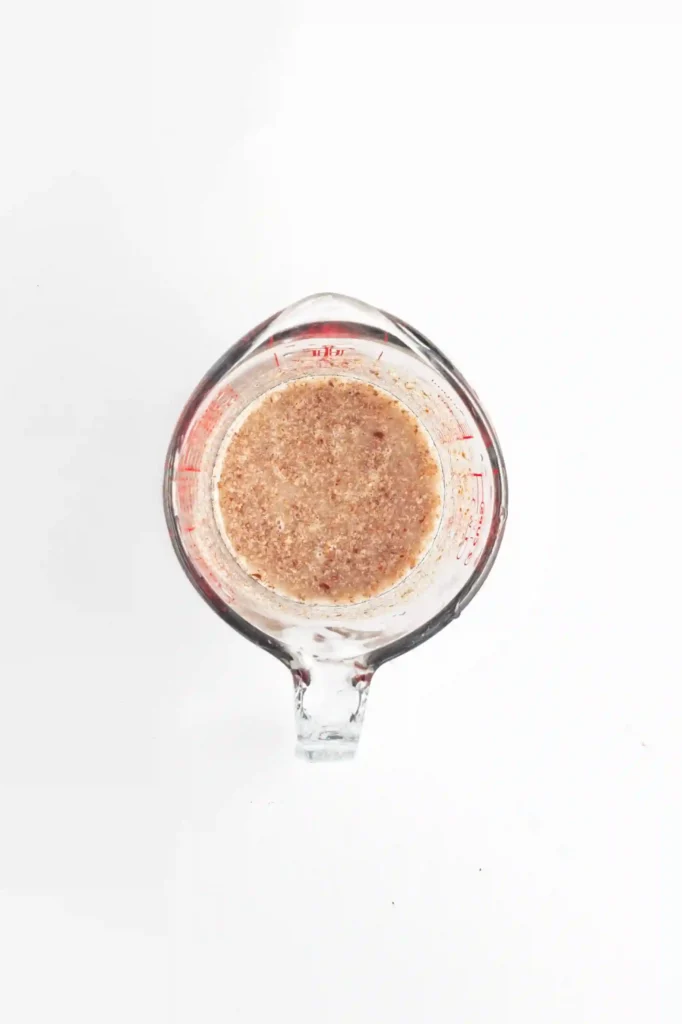 flax seed and water in a measuring cup