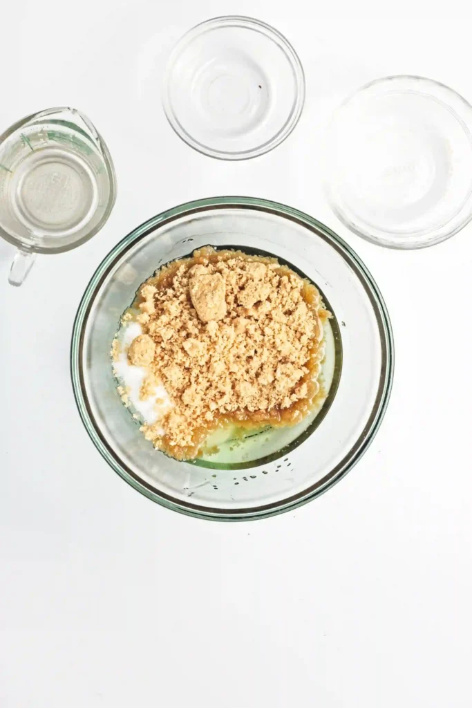 oil and sugar in a glass mixing bowl