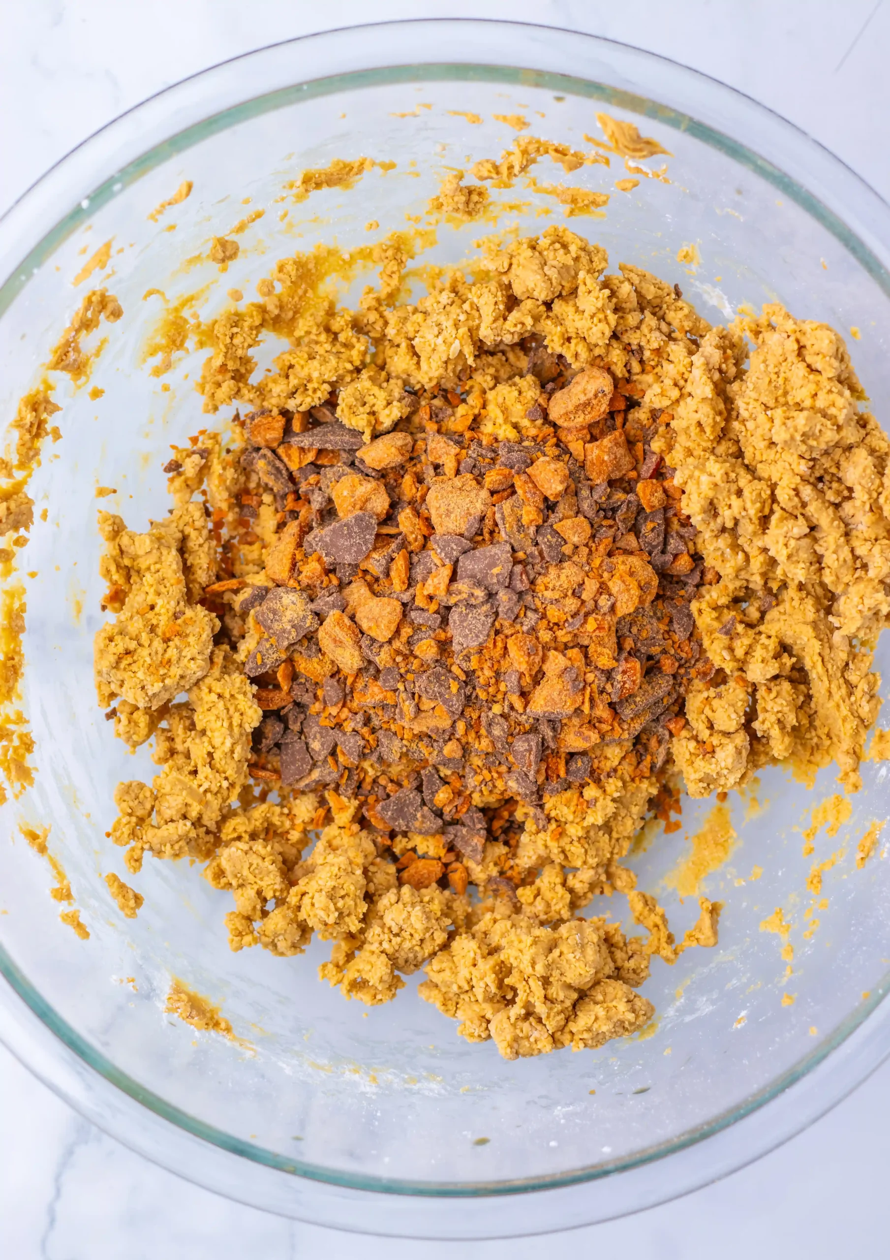 melted butter, crushed butterfingers, an peanut butter mixture