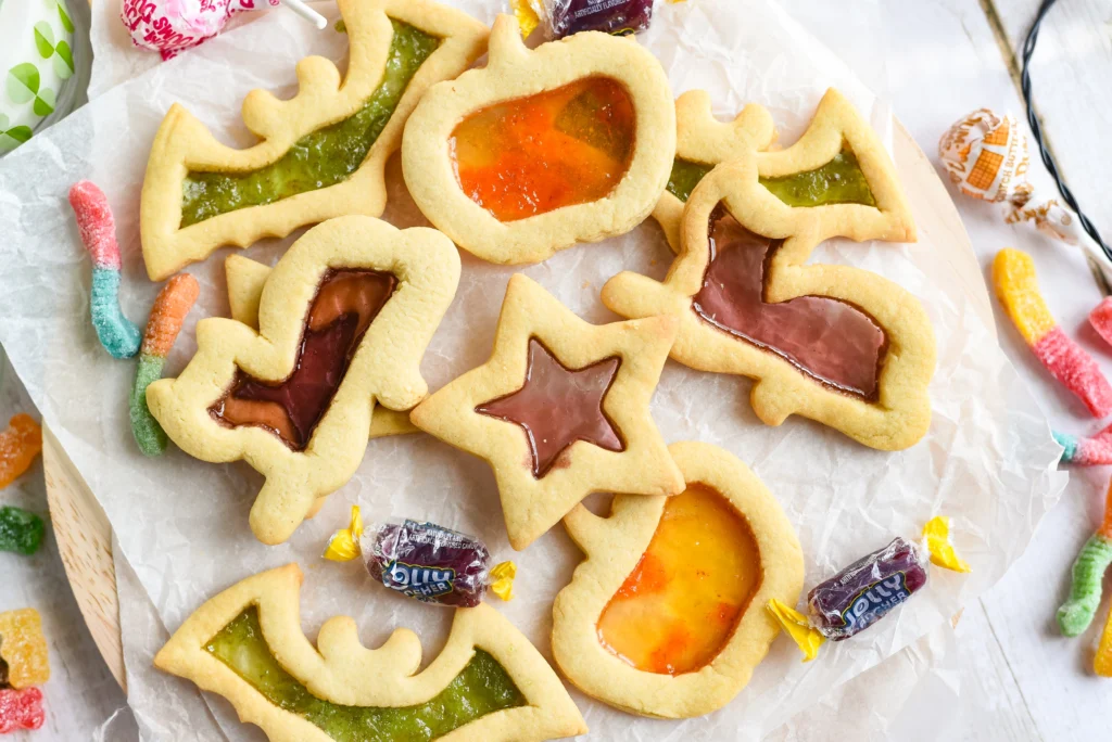 halloween stained glass sugar Cookes on parchment paper