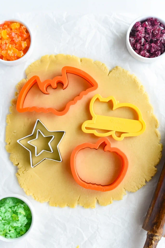 sugar cookie dough with halloween cookie cutters