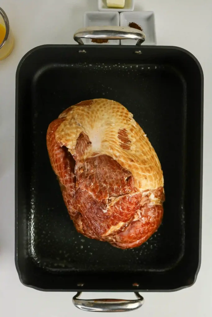 a ham in a baking pan
