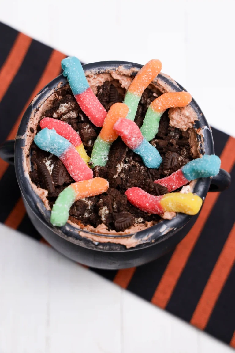 Halloween Dirt Cups in a cauldron and toped with gummy worms