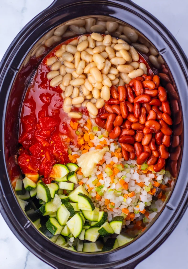 chicken, veggies, and beans in a slow cooker
