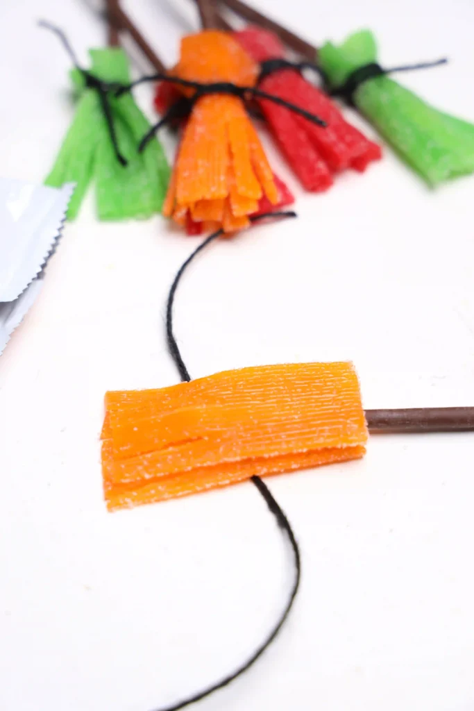 a sour patch strip with a pocky stick inside