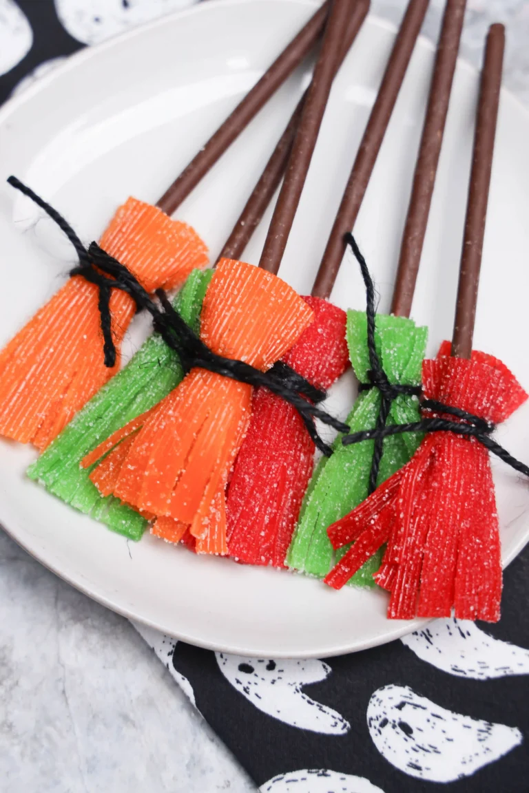 Sour Witch Brooms made of sour patch kid strips and chocolate biscuit sticks