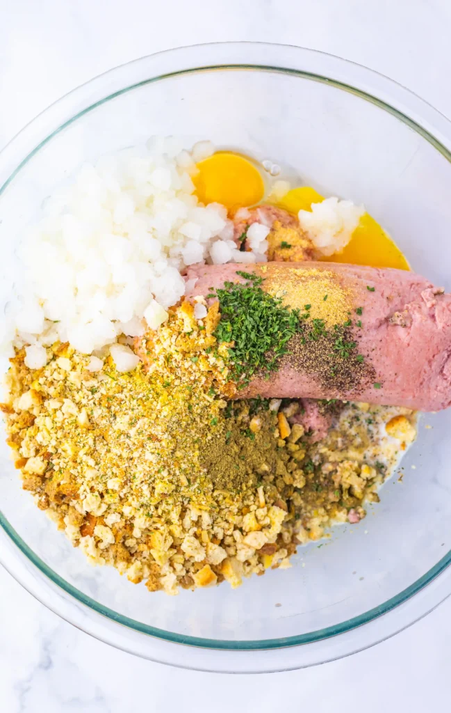  turkey, stuffing mix, eggs, milk, onion and seasonings in a bowl