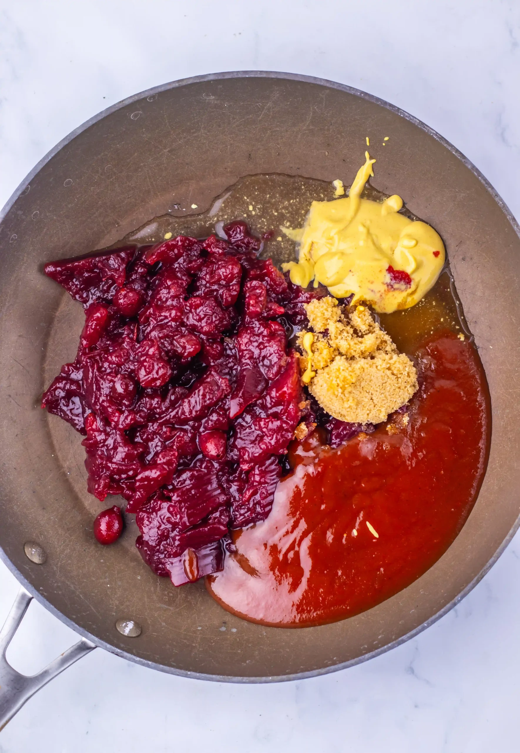 the cranberry sauce, barbecue sauce, brown sugar, Dijon mustard and apple cider vinegar in a pan