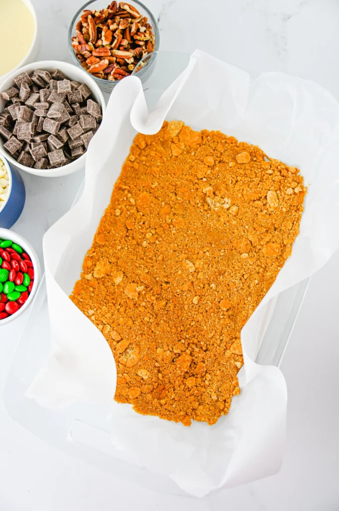 graham cracker crumb crust on a baking pan
