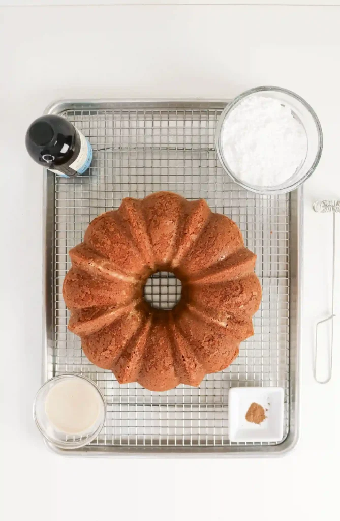 an eggnog pound cake on a cooling rack