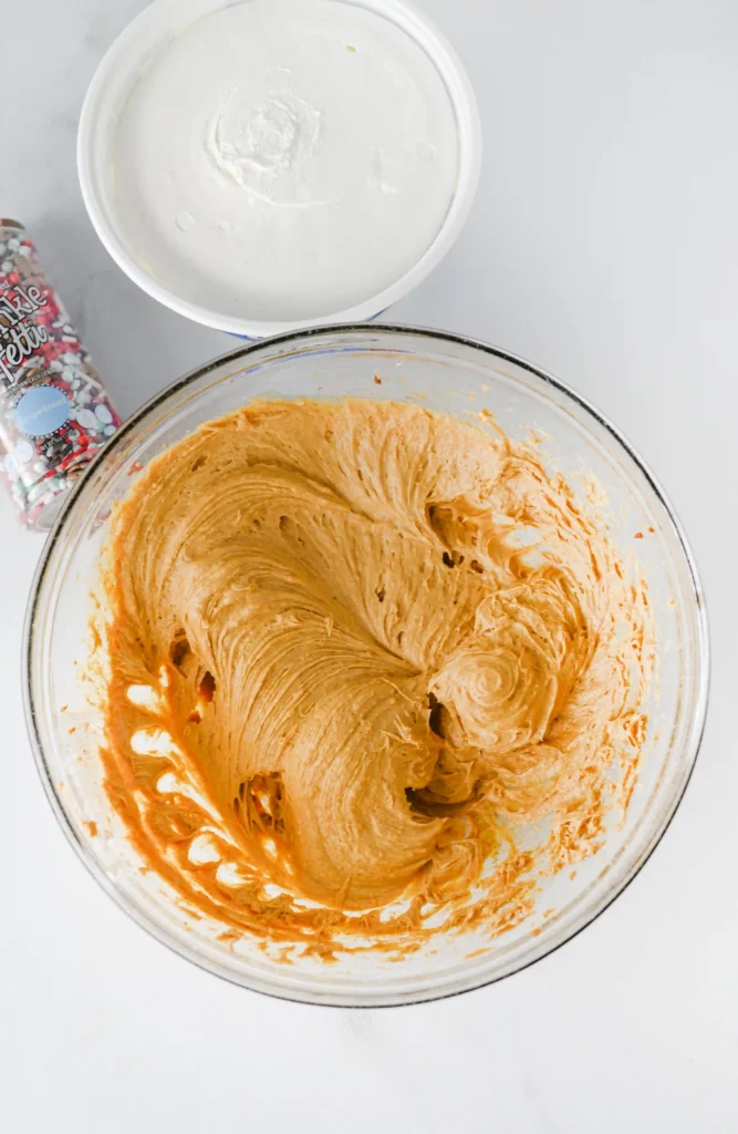 cream cheese, powdered sugar, brown sugar, cinnamon, ground ginger, and molasses in a glass bowl