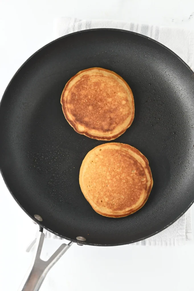 pancakes cooking in a pan