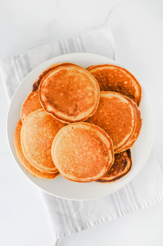 a white plate with pancakes on them