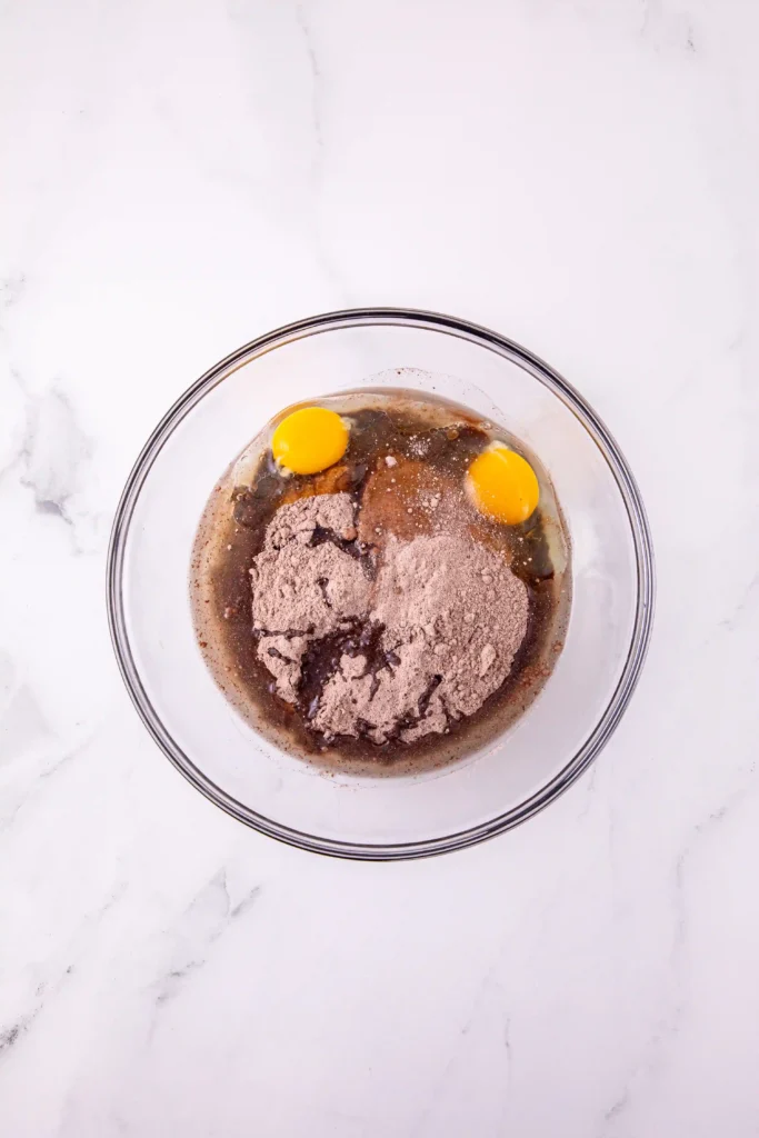 cake mix, oil, and eggs in a glass mixing bowl