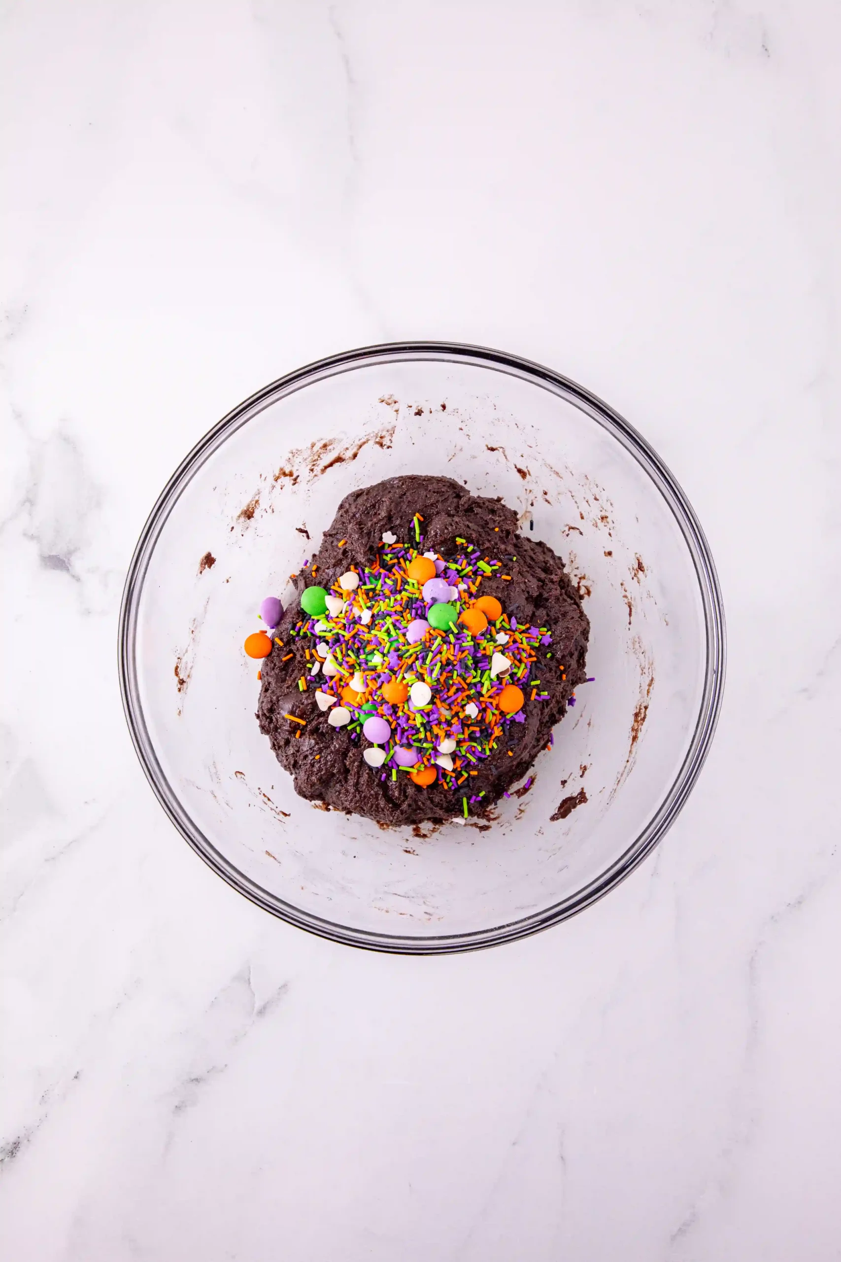 chocolate cake mix in a bowl with halloween sprinkles