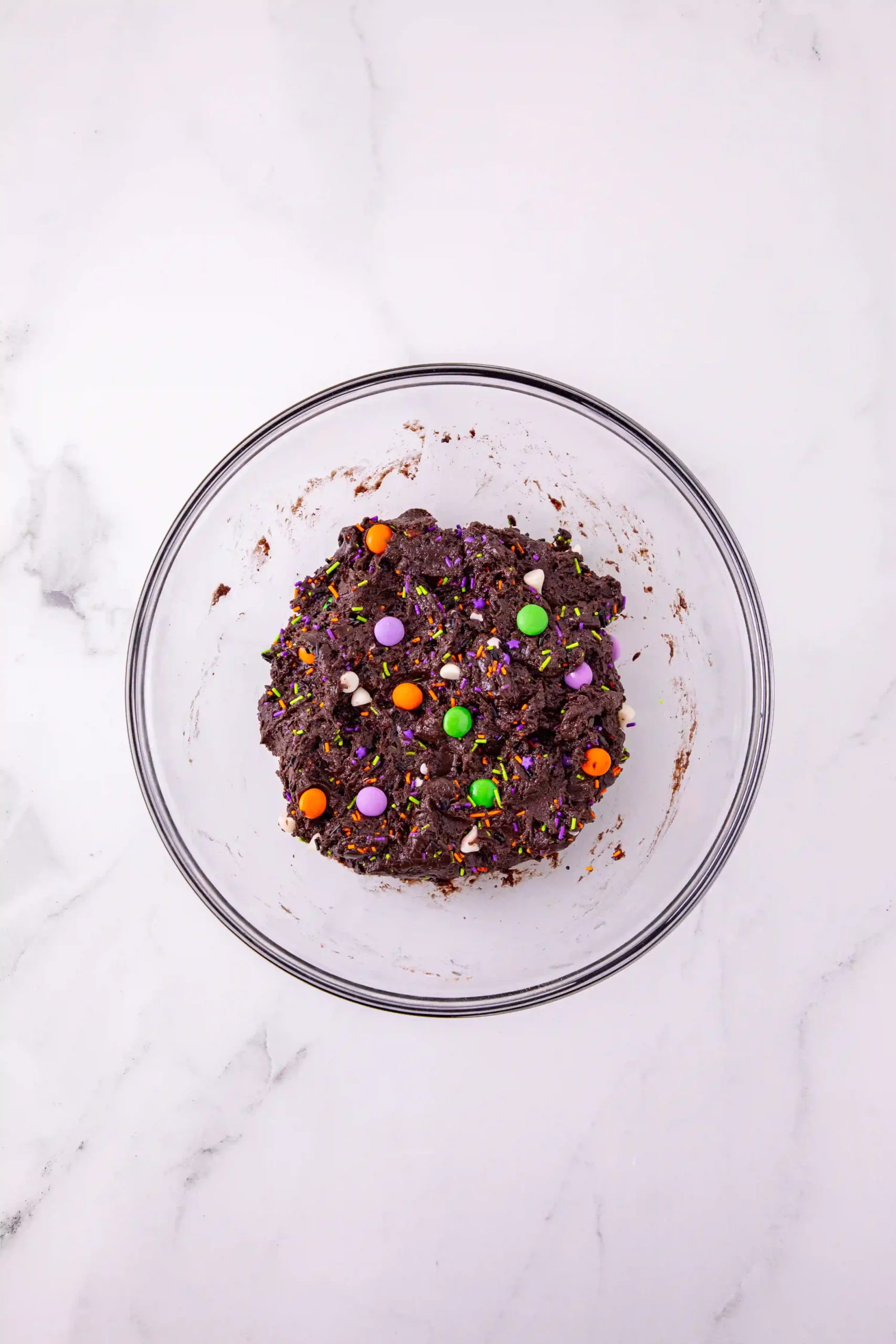 chocolate cake mix in a bowl with halloween sprinkles