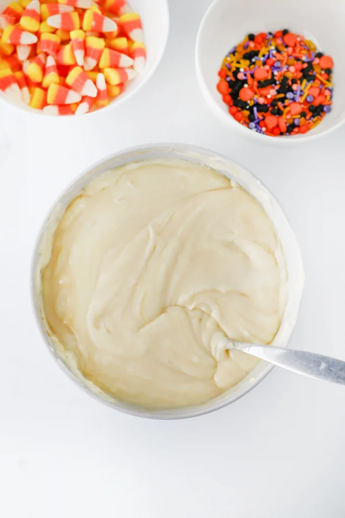 sweetened condensed milk and white chocolate chips melted in a bowl