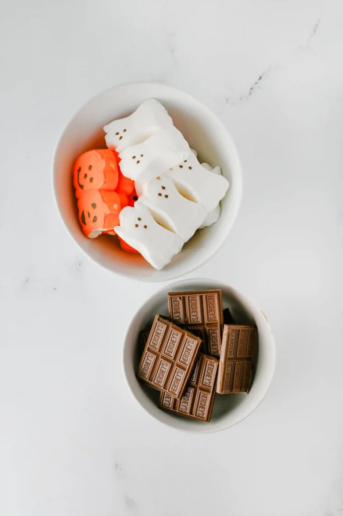 ingredients for the halloween s'mores dip: chocolate and halloween peeps