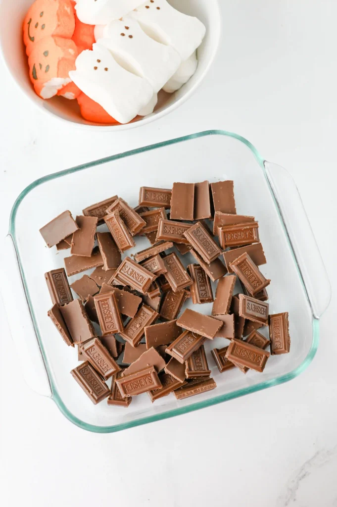 chocolate broken into pieces in a square dish