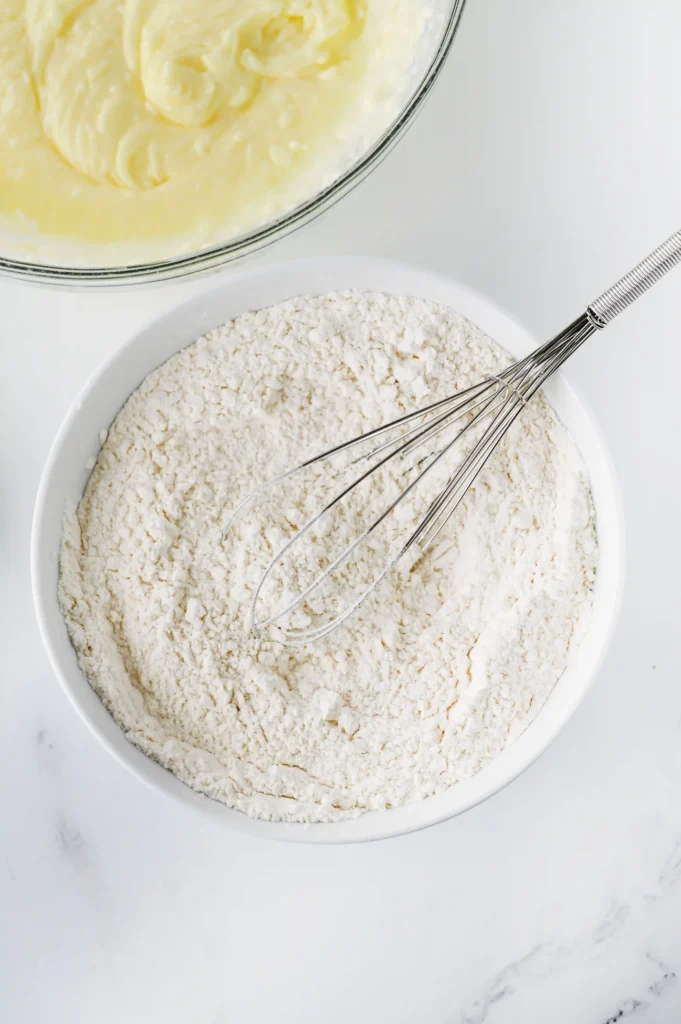  baking powder, cream of tartar, salt, and all purpose flour in a bowl with a whisk