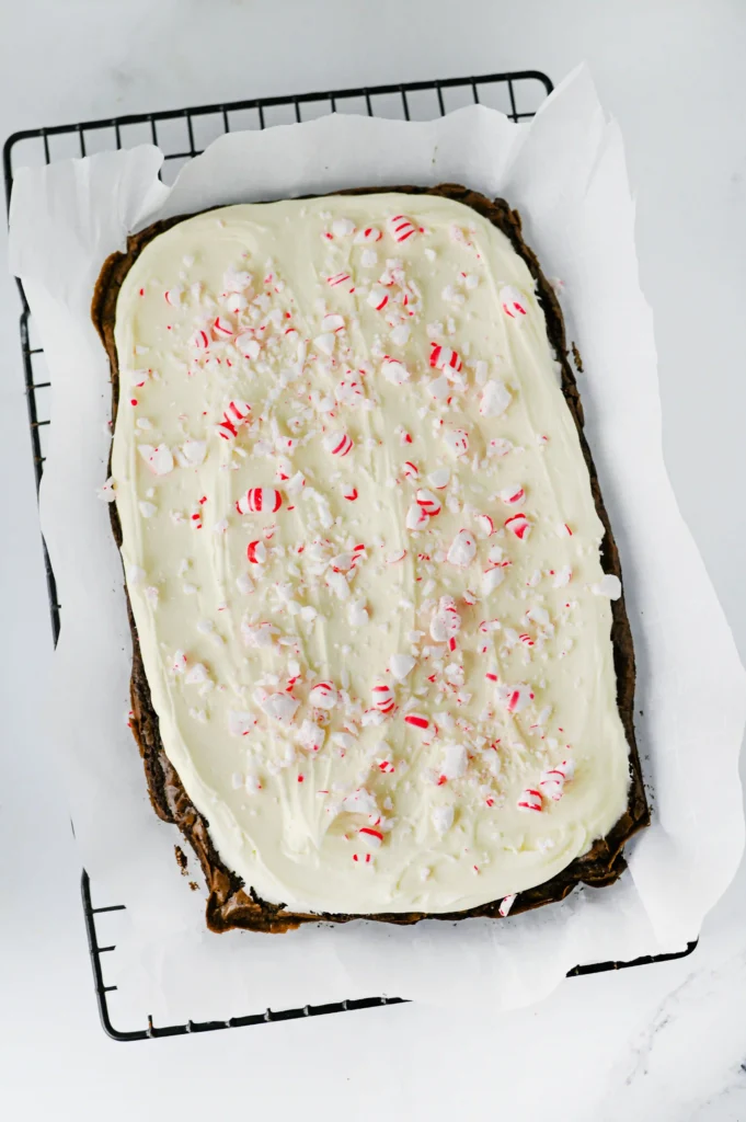 brownies with white chocolate icing and crushed peppermint
