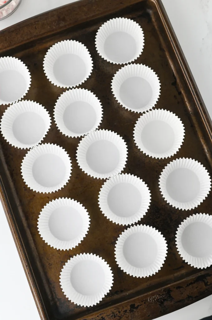 cupcake liners on a baking sheet