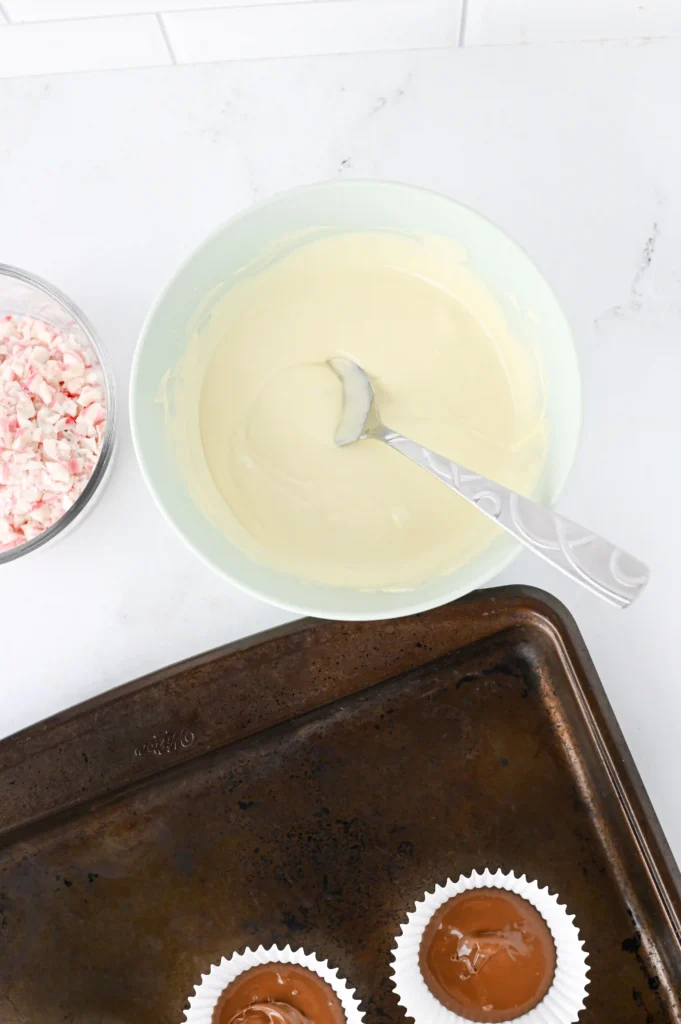 melted white chocolate in a bowl with a spoon