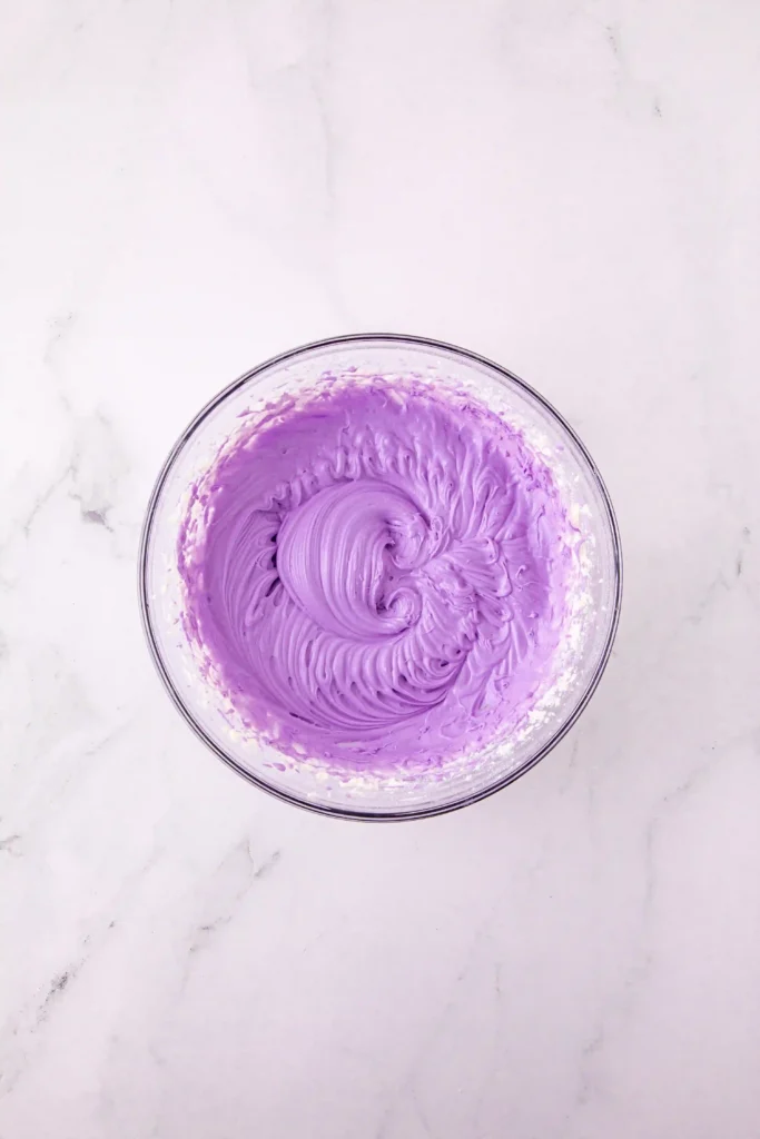 purple icing in a glass bowl