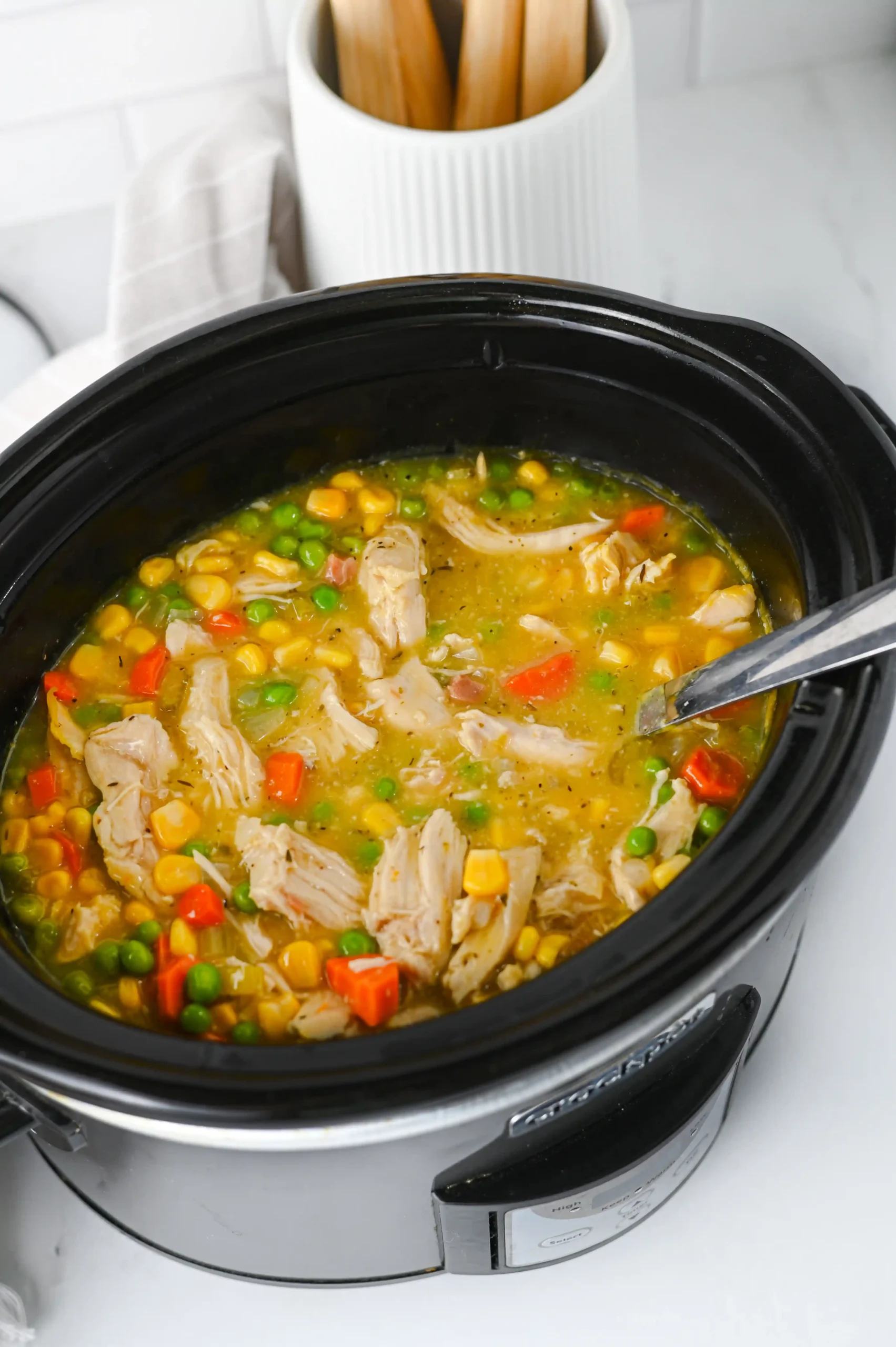 a crock pot filled with chicken pot pie