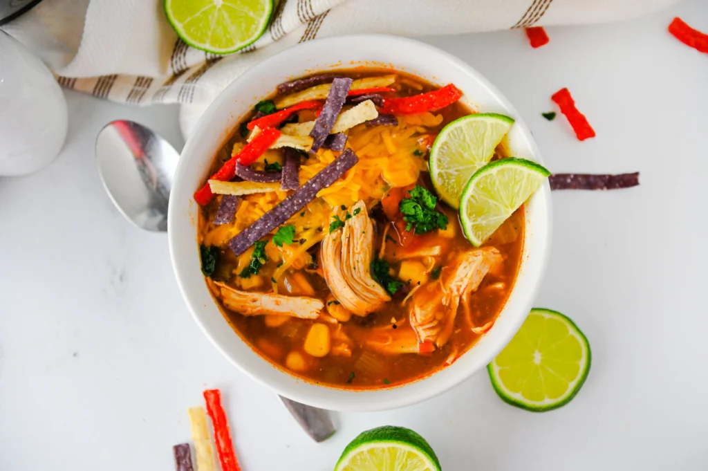 enchilada soup in a white bowl