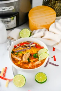 enchilada soup in a white bowl