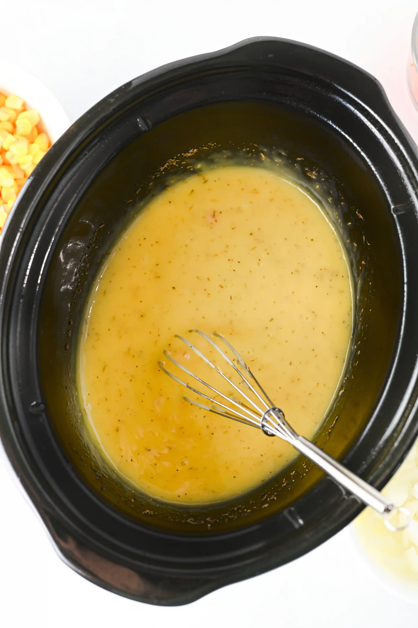 a crockpot filled with cream of chicken soup